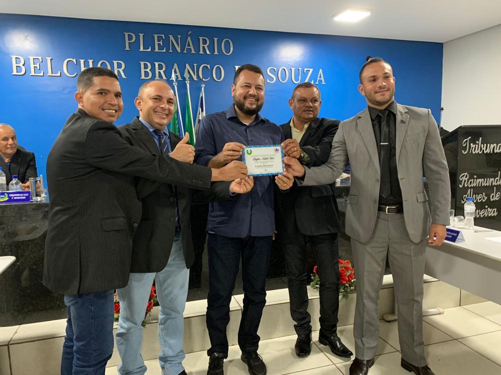 A indicação de Noleto foi feita em conjunto pelos Vereadores Tiago do Zé Jacó (PCdoB), Tatu do Robertão (PCdoB), Alysson do Gino (UB) e Dr Marcos Aguiar (UB).